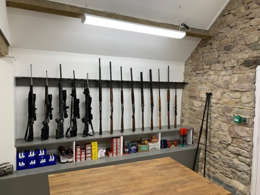guns being held securely at North Wales Fieldsports gunroom